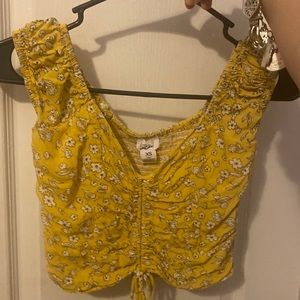 Yellow floral crop top.